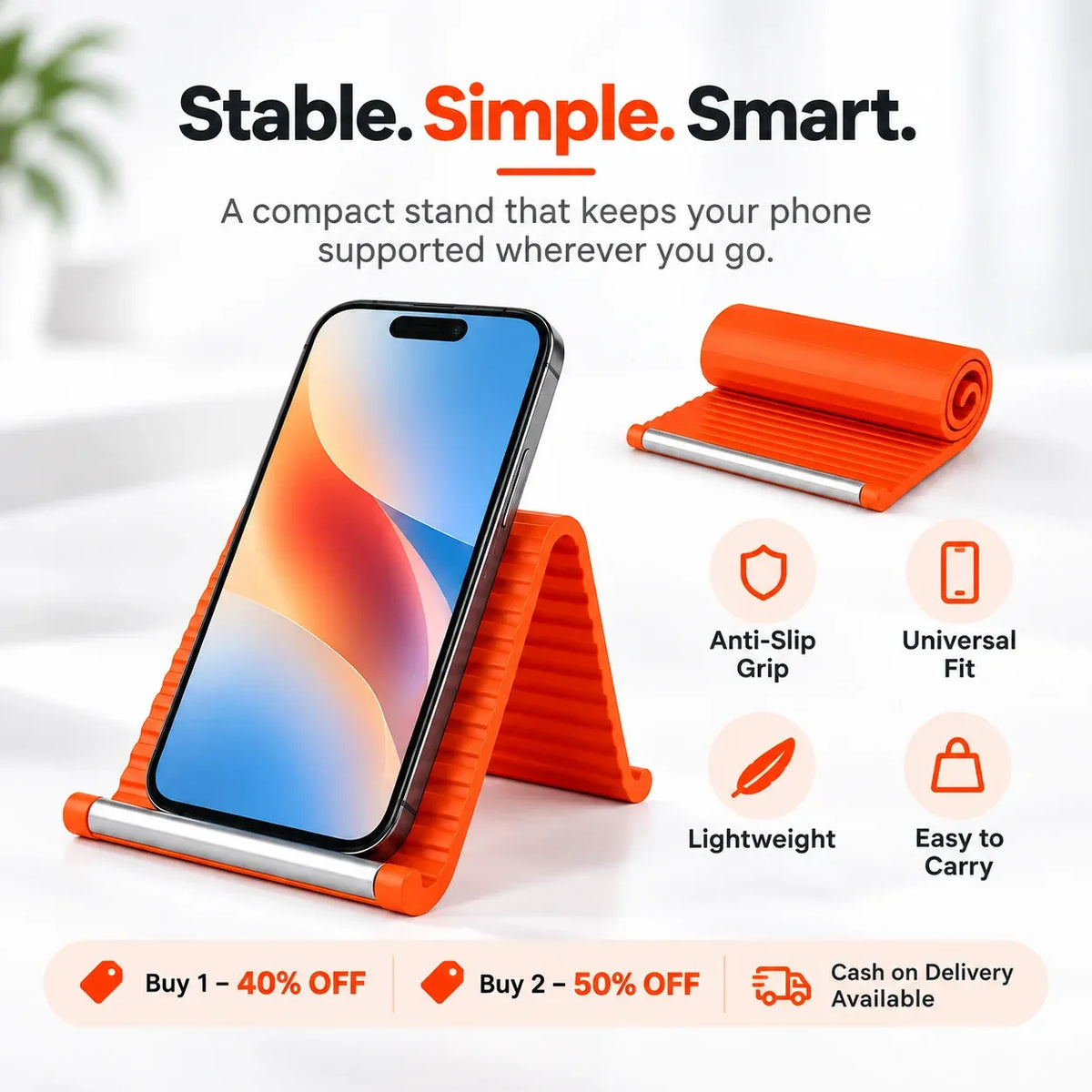 Compact orange silicone phone stand with anti-slip grip, lightweight and easy to carry, shown holding a smartphone upright next to the rolled-up stand